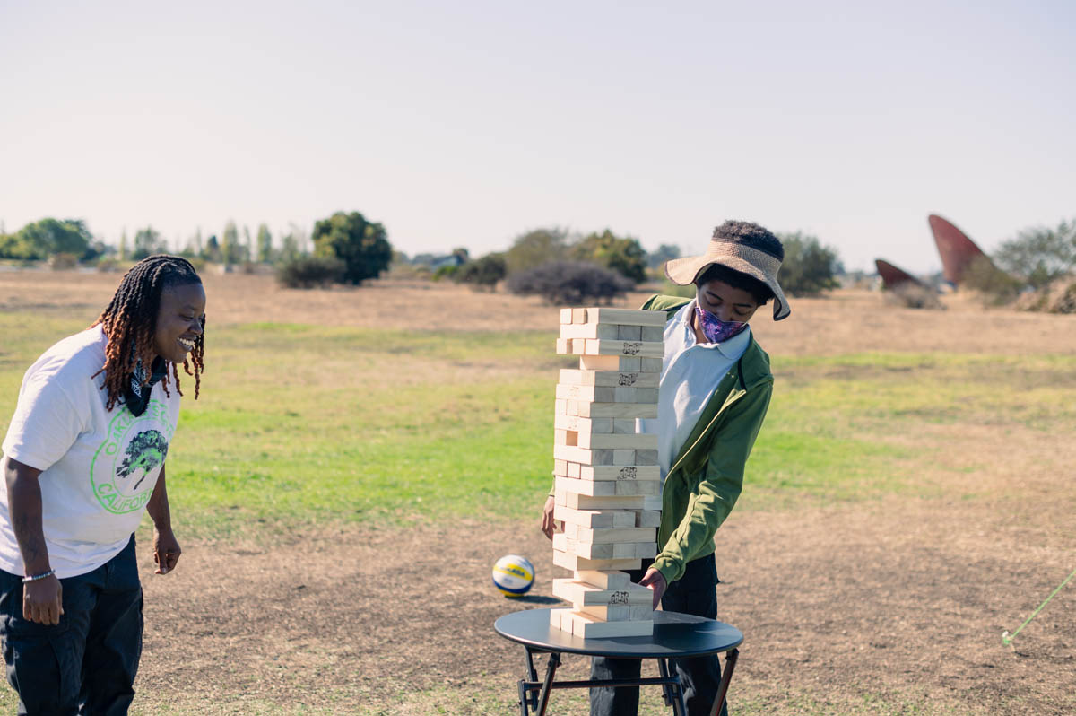 boy builds jenga towner