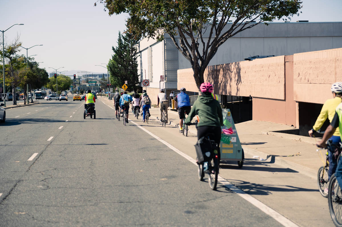 cyclists head down 73rd avenue toward oakland coliseum