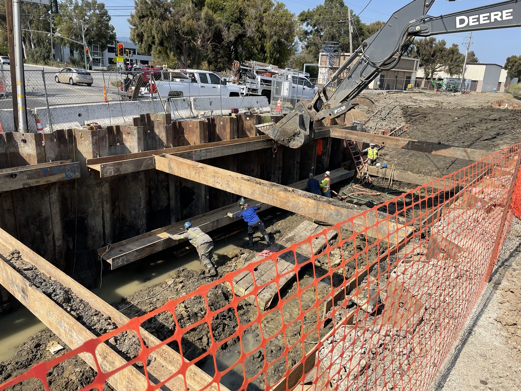 Construction site with open hole in the ground.