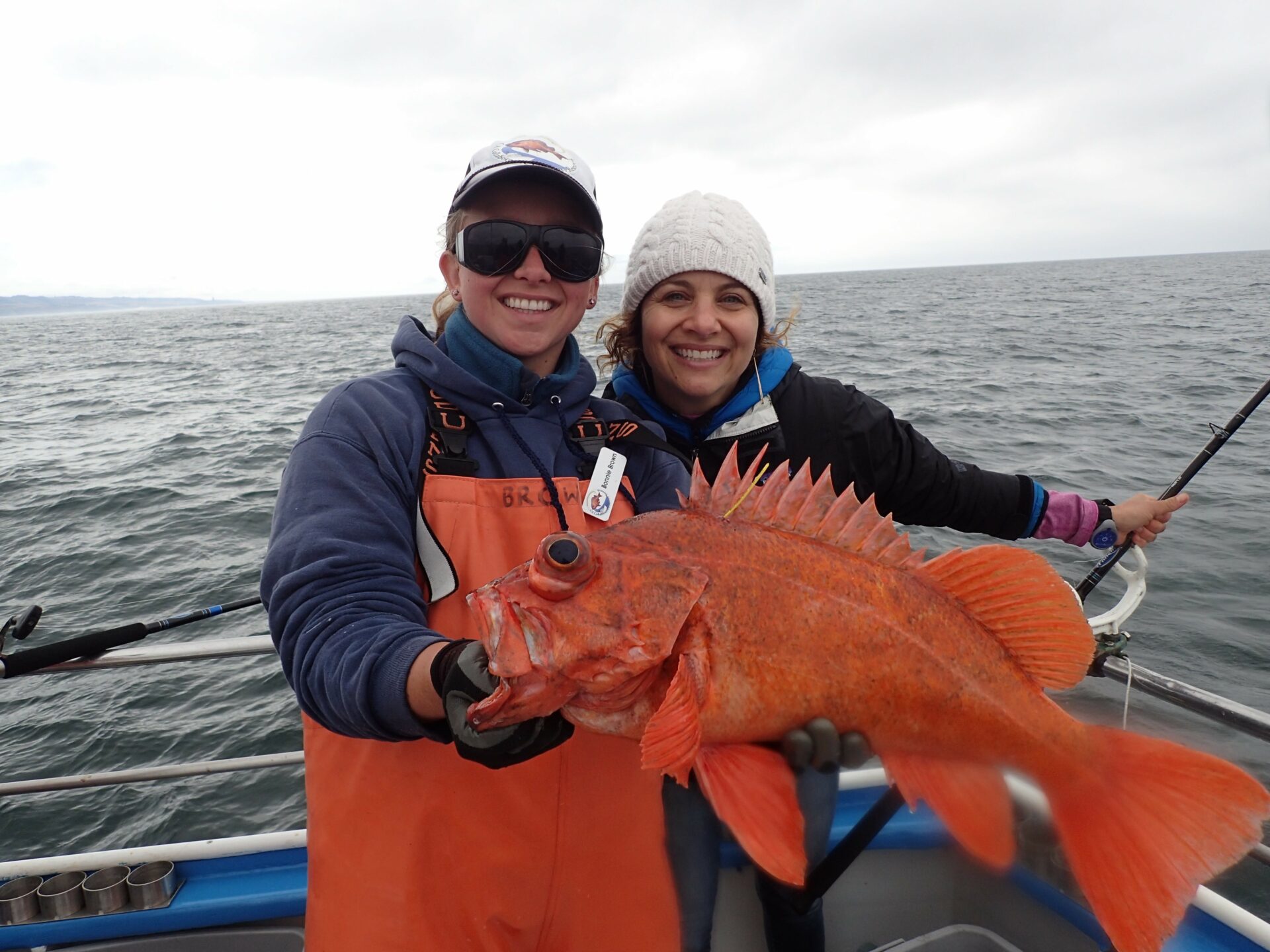 The Ocean Protection Council’s Jenn Eckerle with a vermillion fish and Bonnie Brown of the California Collaborative Fisheries Research Program.