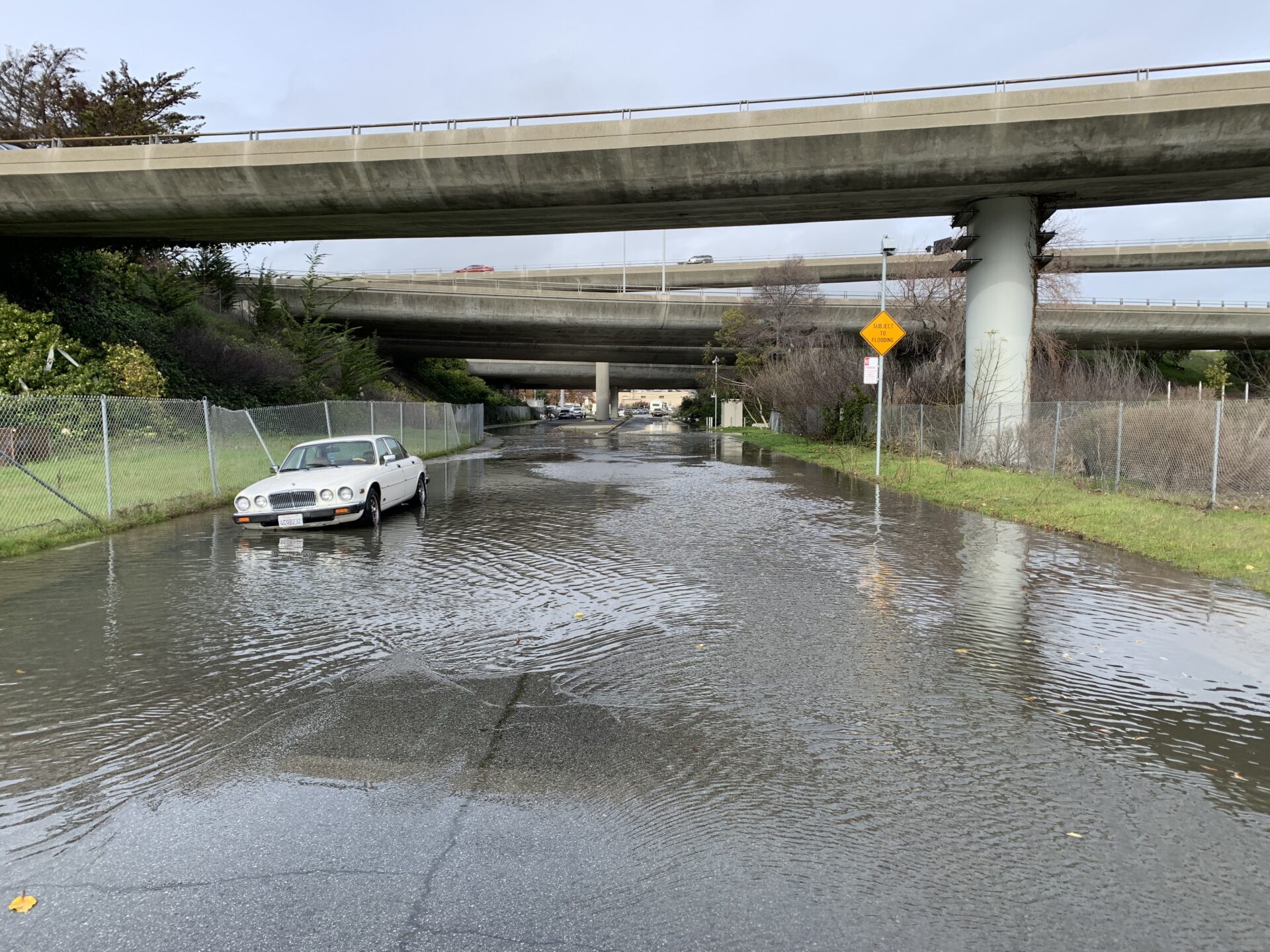 Transportation routes could be cut off by flooding, such as this road in San Mateo County during a recent king tide. Photo: Len Materman.