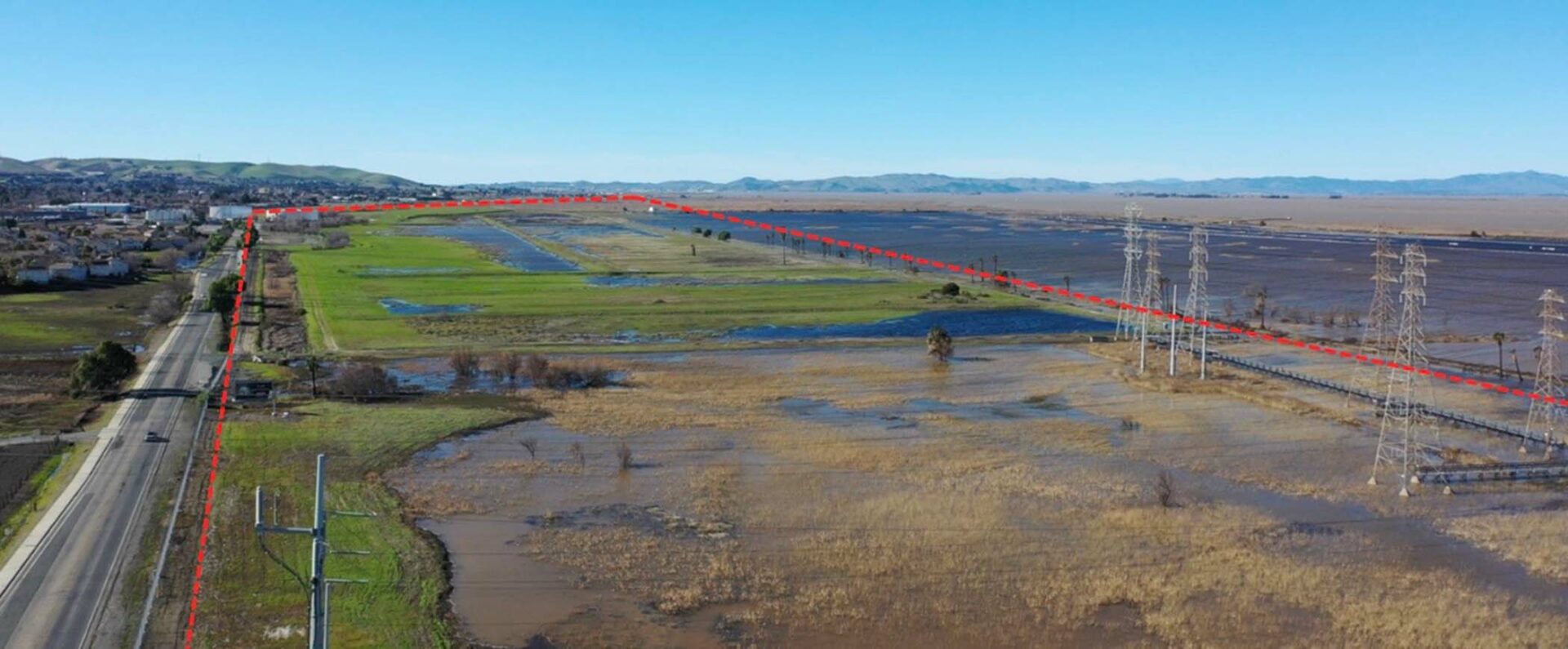 This past spring, when king tides and atmospheric river storms showed us future flood risk from climate change, an overflight by Baykeeper’s monitoring drone Osprey captured flooding at a site near Pittsburg proposed for a housing development. The site includes toxic legacy contamination from a former PG&E power plant, which could be remobilized by flooding, especially if groundwater rise is added to the flood threat mix. Photo: Baykeeper.