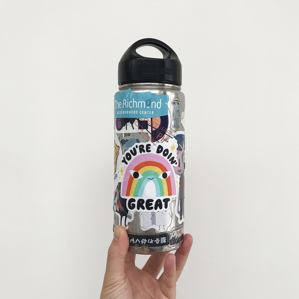 photo of water bottle with stickers by Alyson Wong