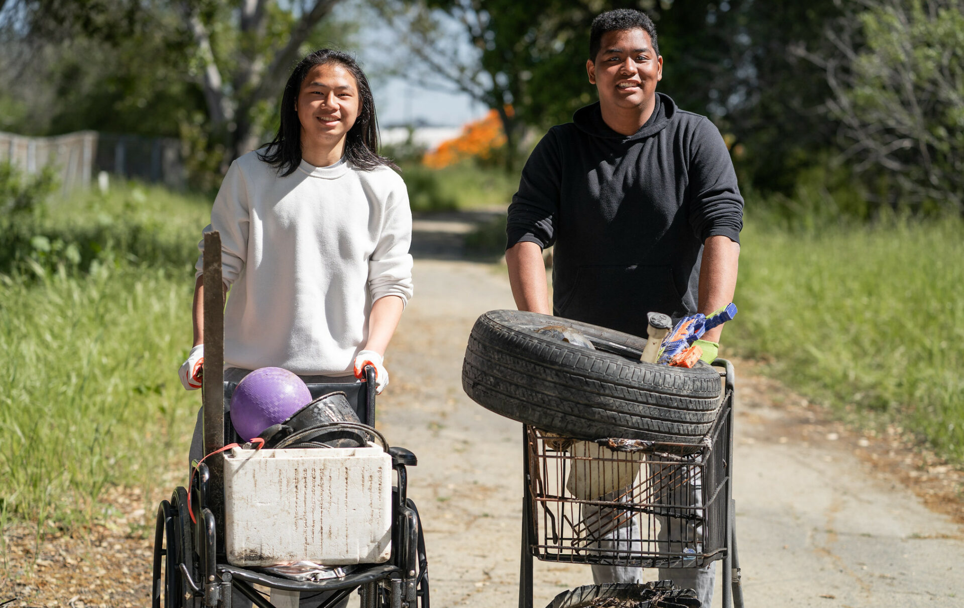 Young people help with trash removal from Richmond creek. Photo: Shira Bezalel.