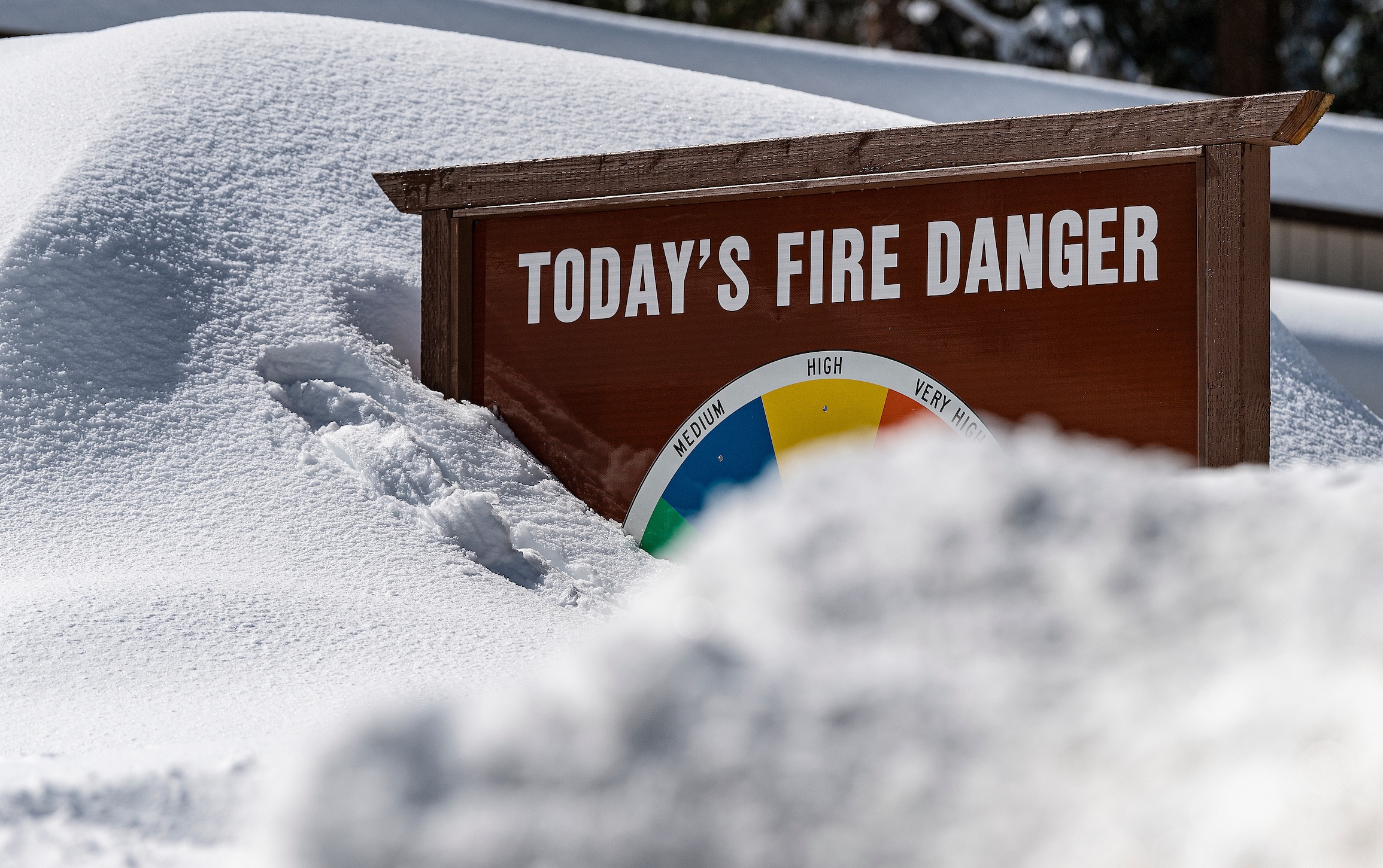 Fire danger sign in snow. Photo: Andrew Innerarity, DWR