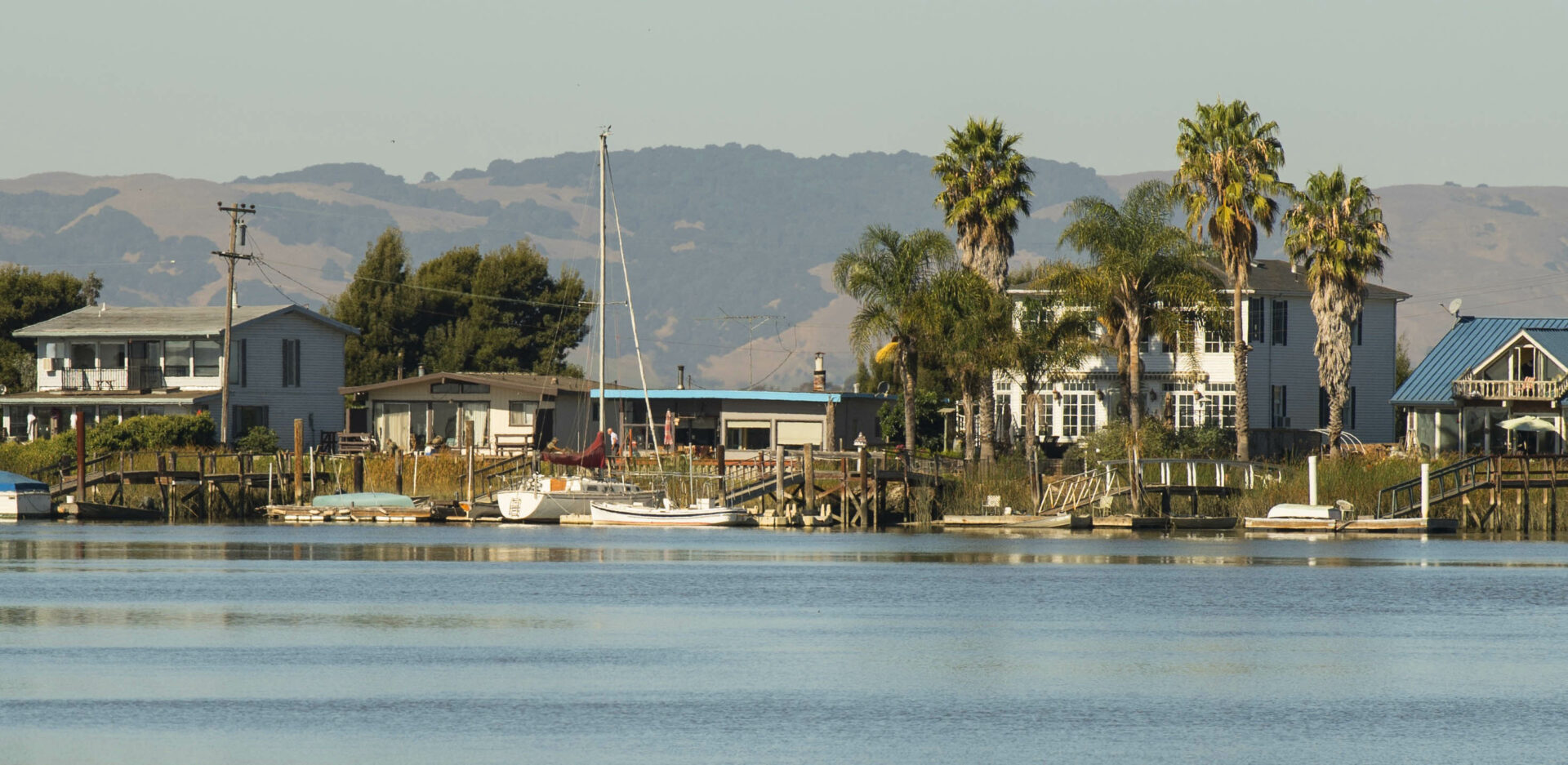 View of community over docks and current levee from Napa River. Photo: Karl Nielsen